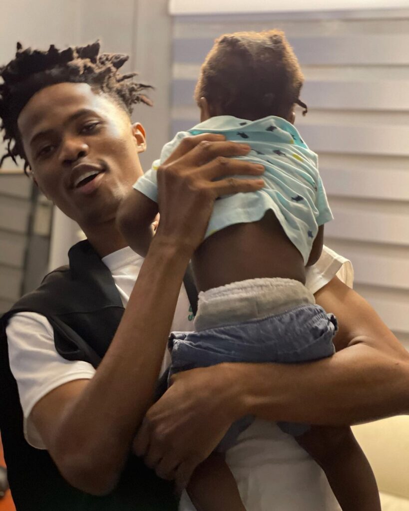 Daddy duties: Watch as Kwesi Arthur plays with Fameye's son in a new video