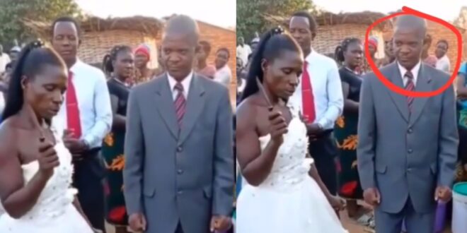 Groom looks worried after his angry bride refuses to drop knife after cutting their wedding cake (video) 1
